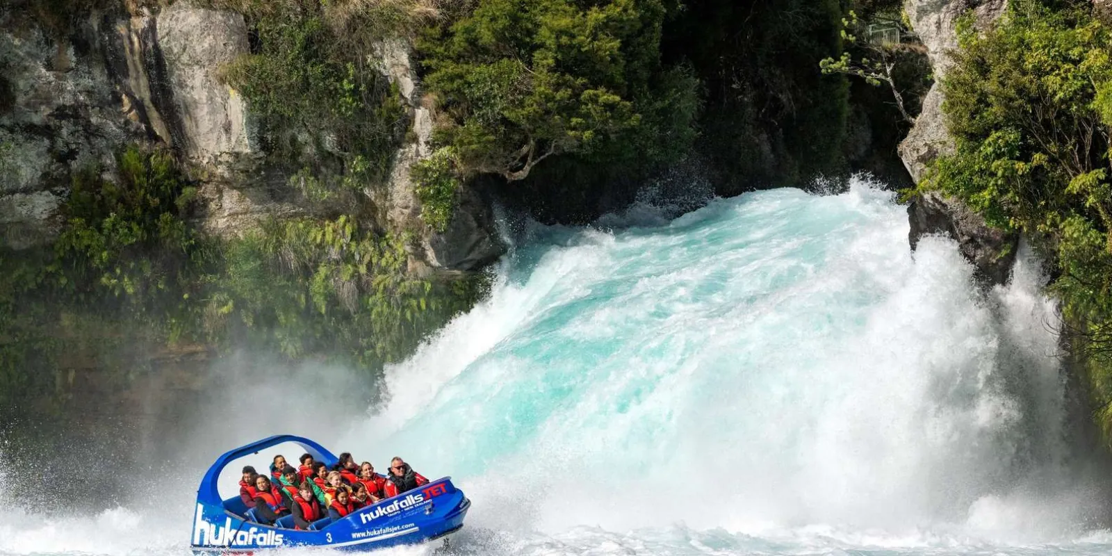 Hukafalls Jet boat approaching the white water below Huka Falls